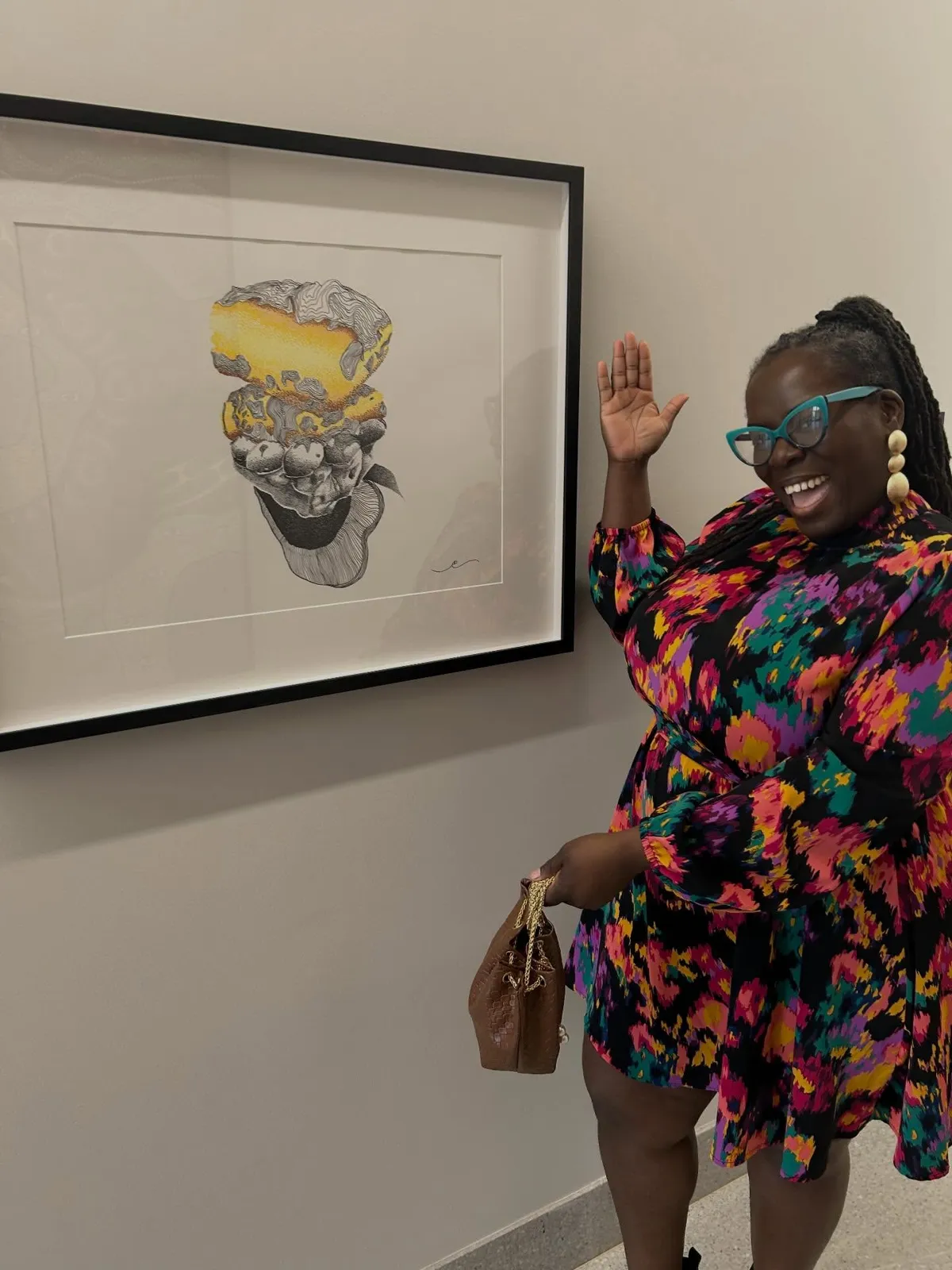 Eyerratic beside her piece BeignYAY at LSU Health Shreveport